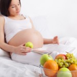 Pregnant woman with fruit